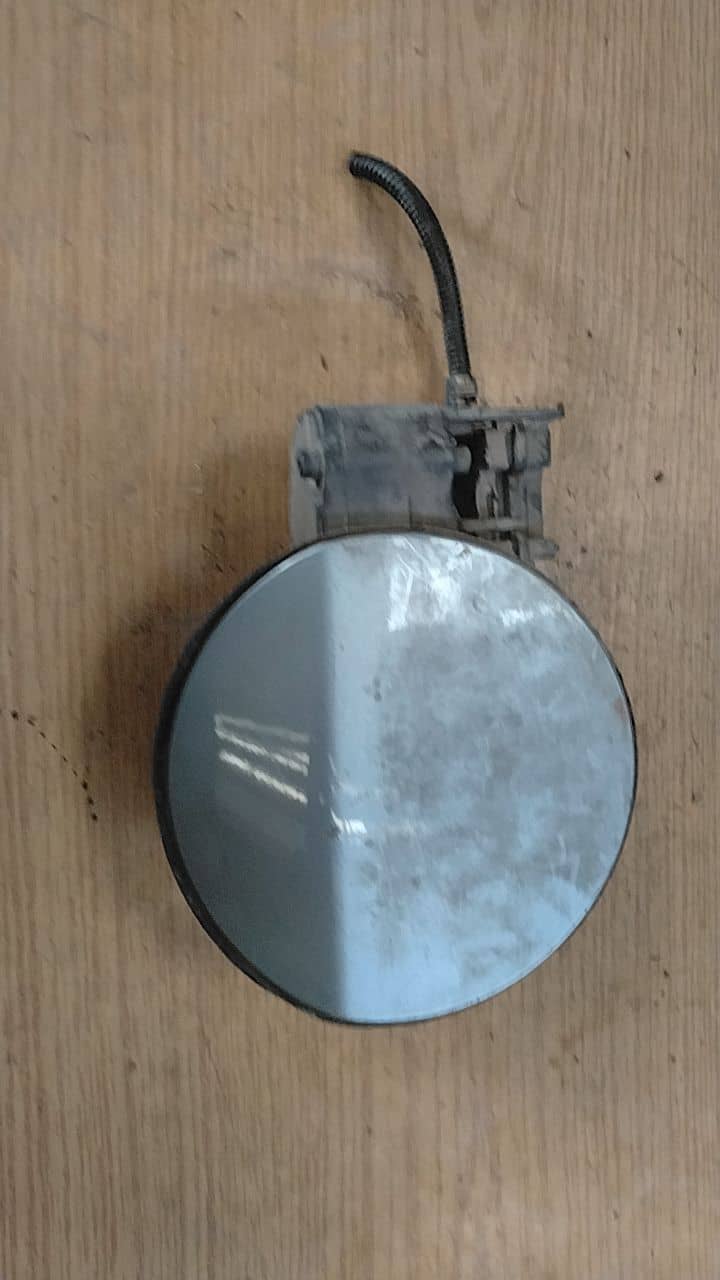 TAPA EXTERIOR COMBUSTIBLE